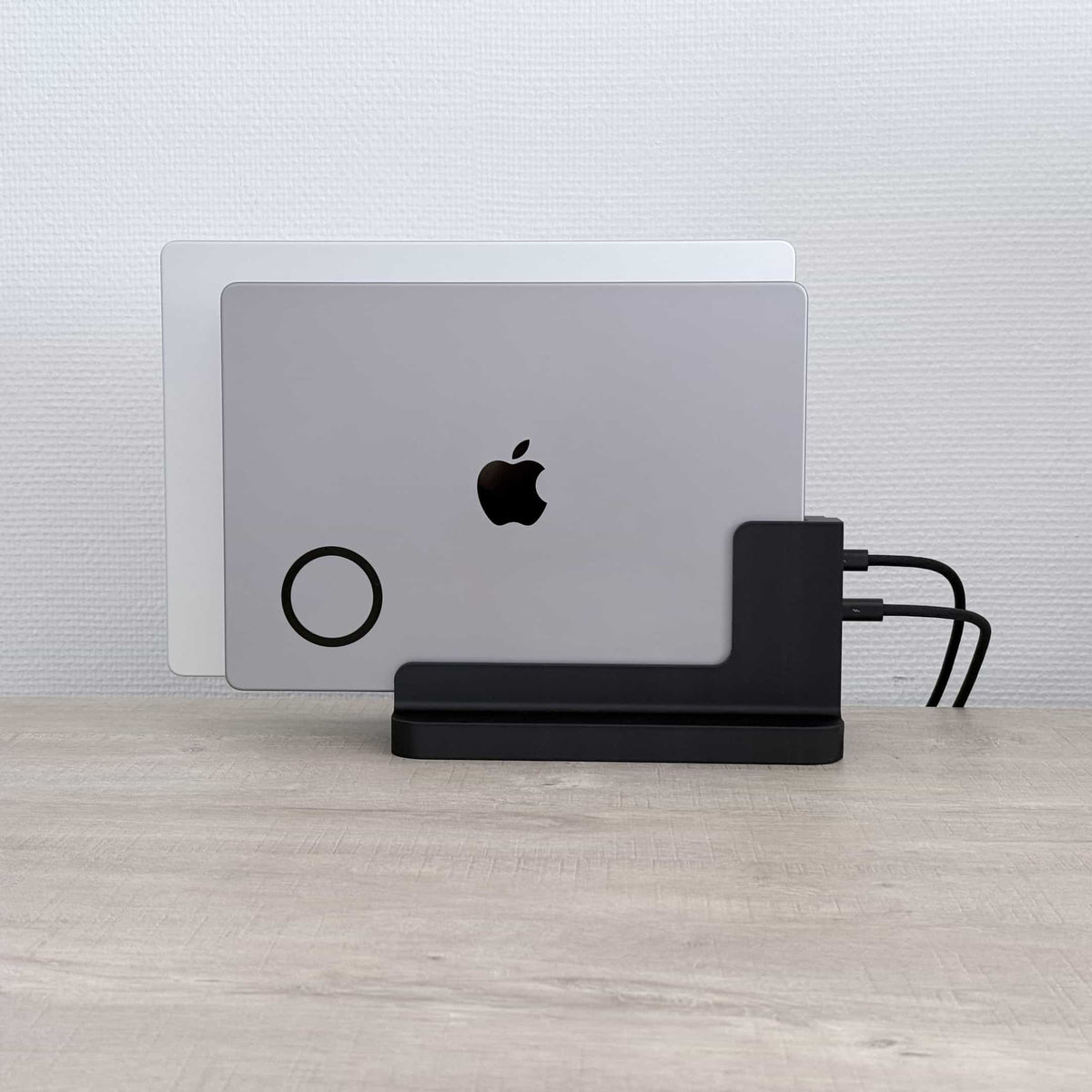SlideBase Duo with two MacBooks docked upright, front view
