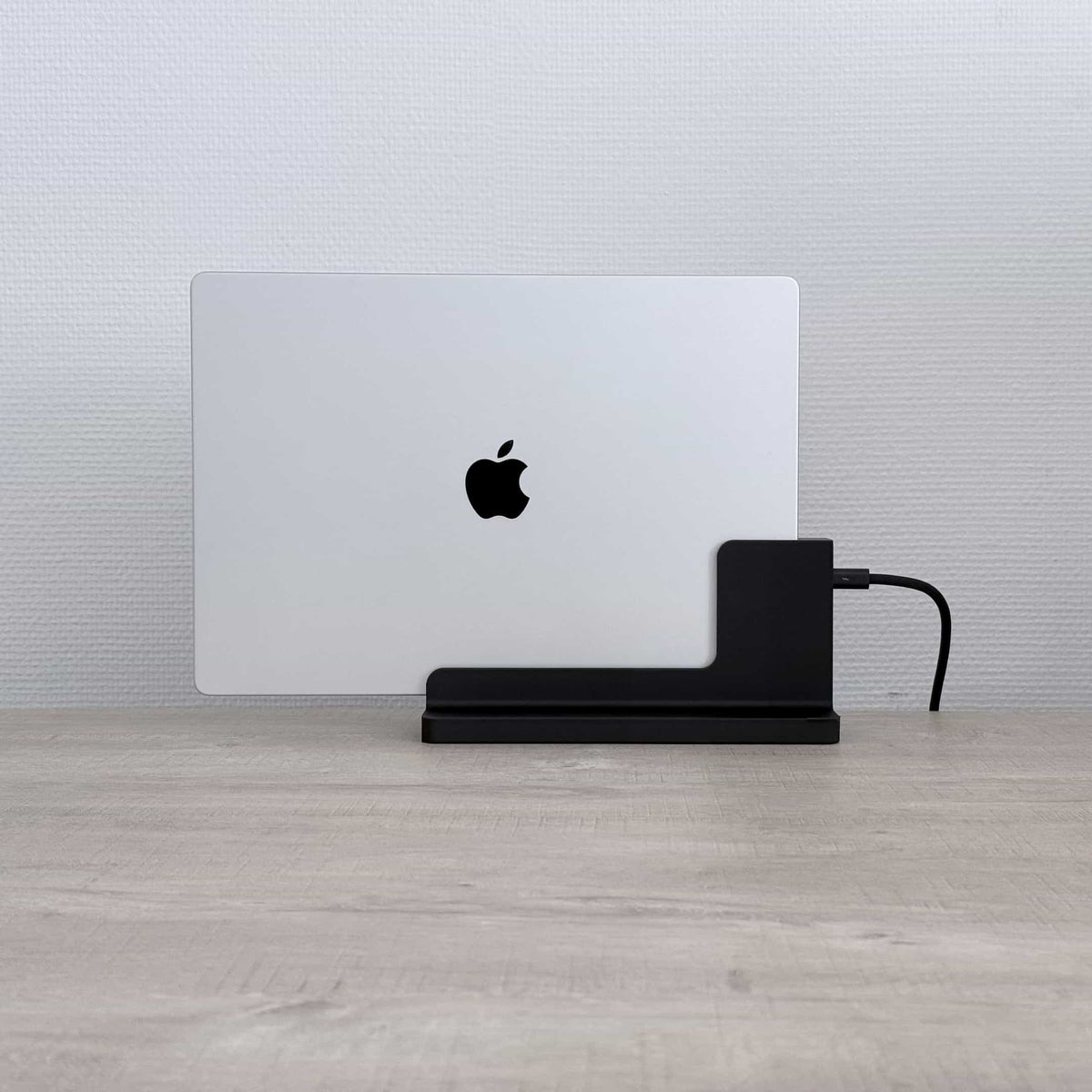 SlideBase Solo with a MacBook docked upright, front view